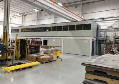 Zoomed out photo of two-tier modular office before trim installed