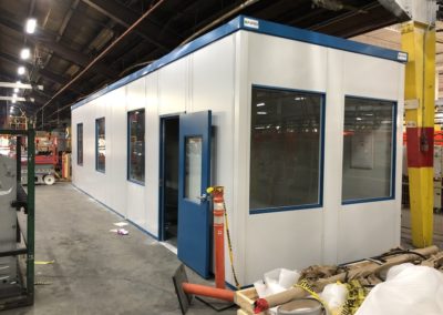 Modular Office Structure with tall windows, blue trim and blue door in London, Ontario Canada.